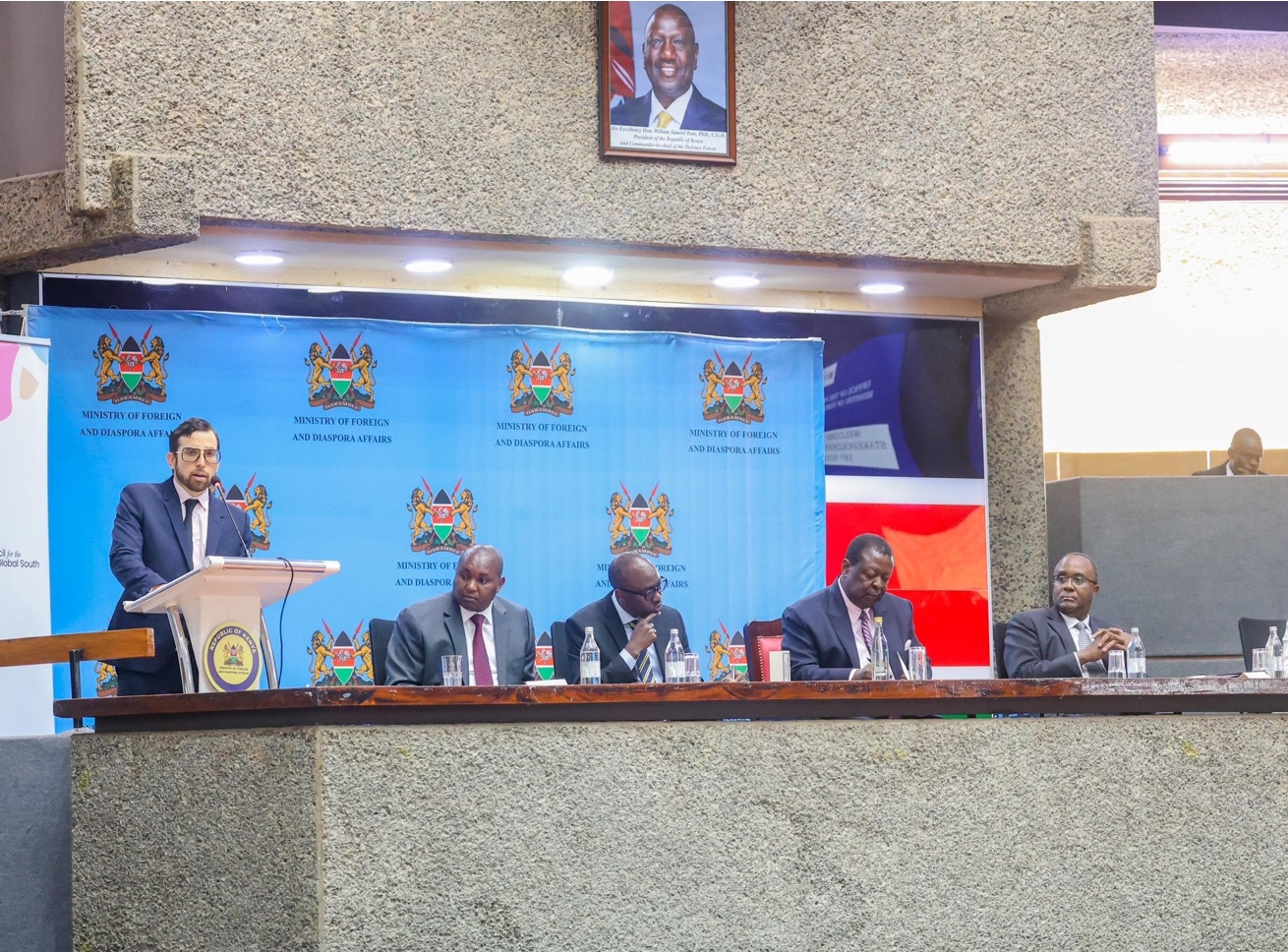 Joseph Hammond speaking at Kenya’s Ministry of Foreign and Diaspora Affairs in Nairobi, with Musalia Mudavadi and fellow panelists.